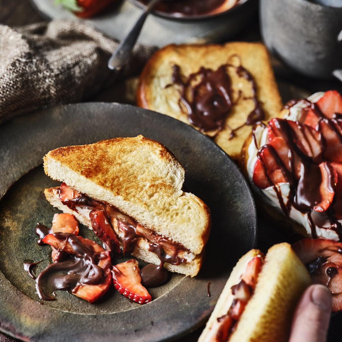 Thick toastie filled with fresh strawberries and smooth hazelnut chocolate spread